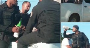 Policía ingiriendo cerveza en camioneta.